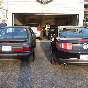 Both cars in front of our house