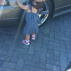 Helping daddy clean the stang.