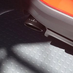 Powder-coated exhaust tip-matte black; close up.