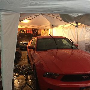 C63 and Mustang both tucked away in dry areas (tent was a little leaky in a few places but I persevered) :D
