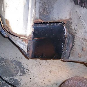 R/S outer torque box section being welded in.