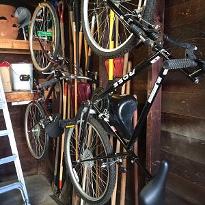 bikes hung from ceiling. notice the floor space and wall space on the right.