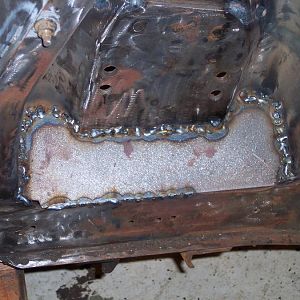 10/9/16 Finished welding in the l/s wheel side Boss 302 shock tower reinforcements.