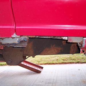 Rusted out rocker section cut out.