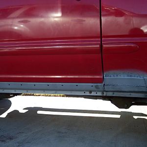 Lower quarter panel patches welded in.