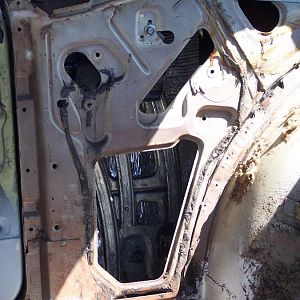 9/23/17 Insulated inside of r/s quarter panel & installed quarter window track & bracket.