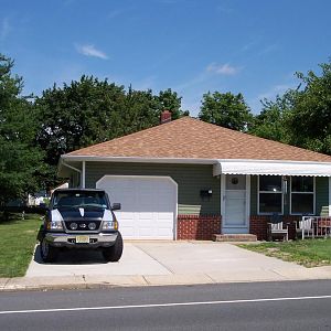 After. Our house with new siding, & windows.