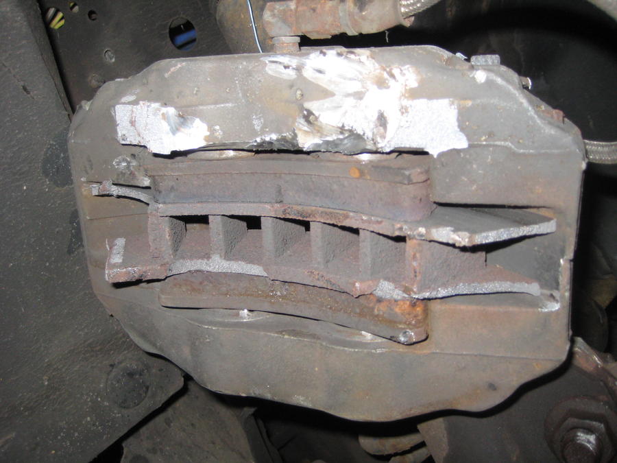 The BAD...this is what is left of the caliper and rotor. As you can see